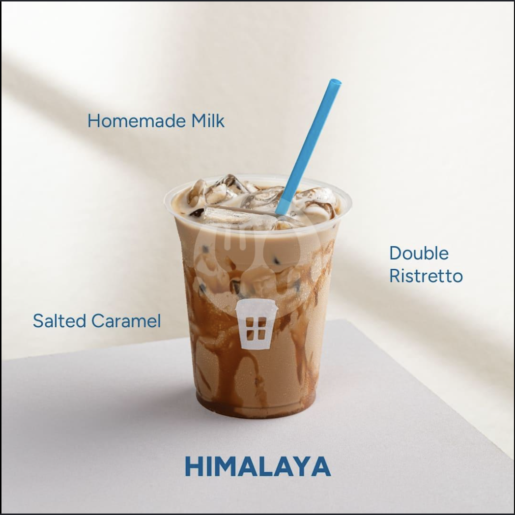 A creamy Cosan iced latte with caramel